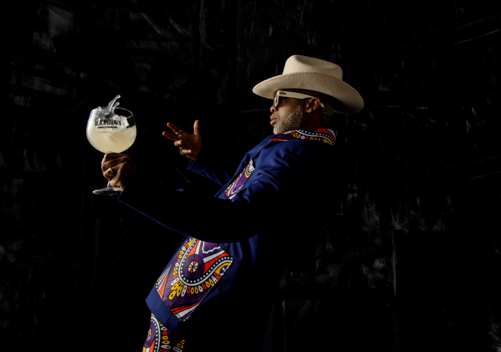 Kay Kay Ribane holding a Black Crown Amarula flavour in a glass